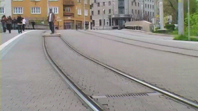 tomas moravec hacks a wooden pallet to glide down tram tracks
