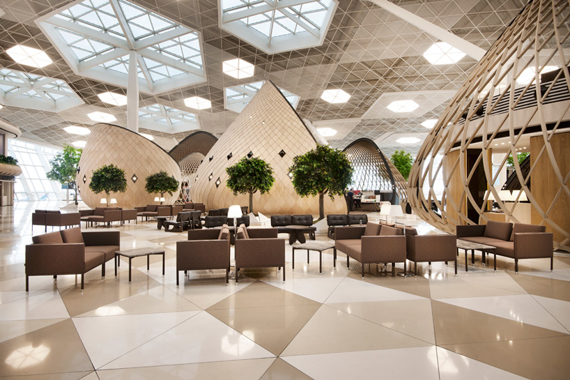 autoban organizes heydar aliyev international airport with wood cocoons