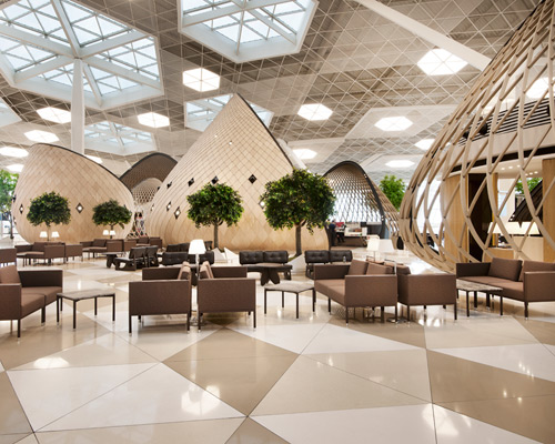 autoban organizes heydar aliyev international airport with wood cocoons