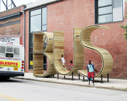 waiting for the BUS inside a giant typographic sculpture by mmmm...