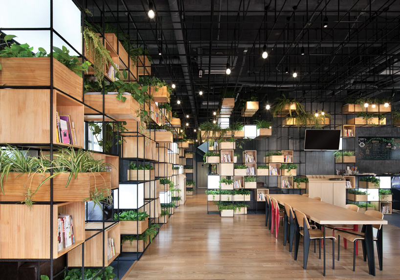 recycled steel bars form modular café interior by penda