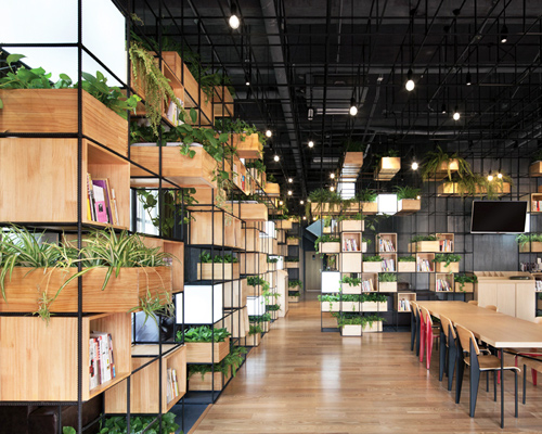 recycled steel bars form modular café interior by penda