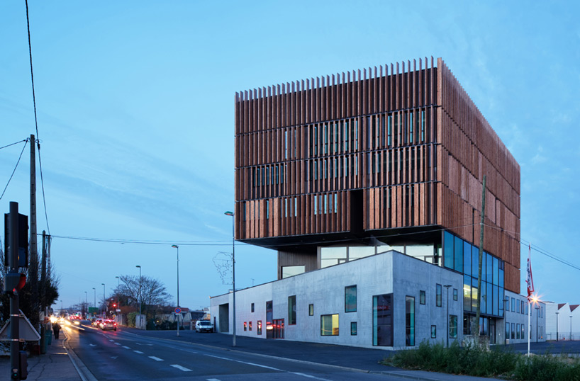 wood louvers wrap mantois technology center by badia berger in france