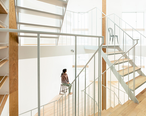 central staircase connects house in kamiosaki by comma design office