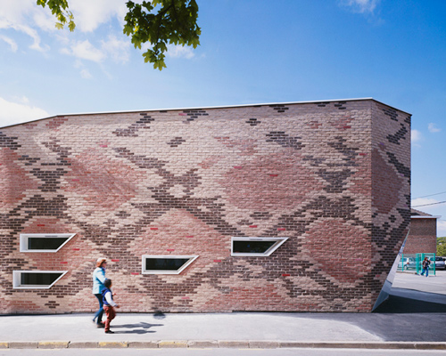 d'houndt+bajart clads school canteen in snakeskin brickwork