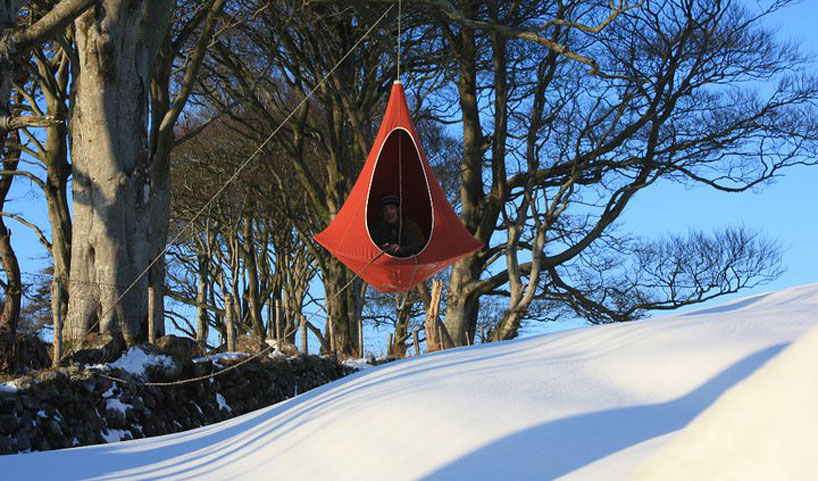 hang in out s cacoon hammock lifts you above the trees