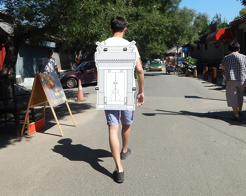 pedestrians wear architecture for instant hutong's interactive art piece