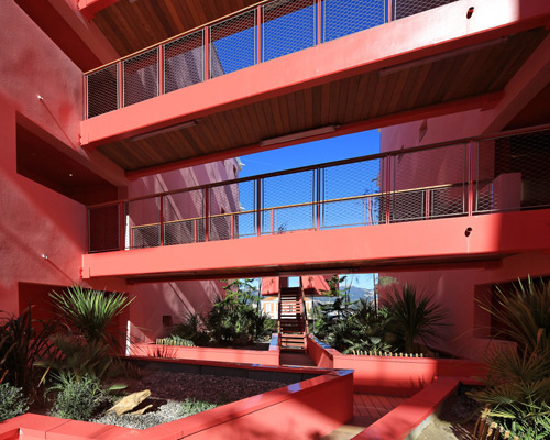 pietri architectes cuts canyon courtyard through redline apartments