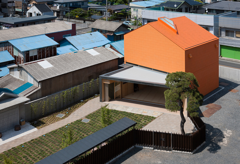 taku sakaushi renovates orange-clad office building in japan