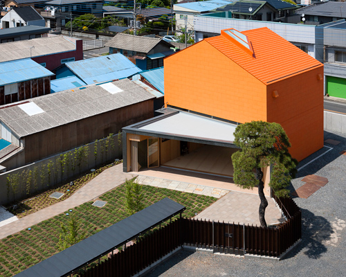 taku sakaushi renovates orange-clad office building in japan