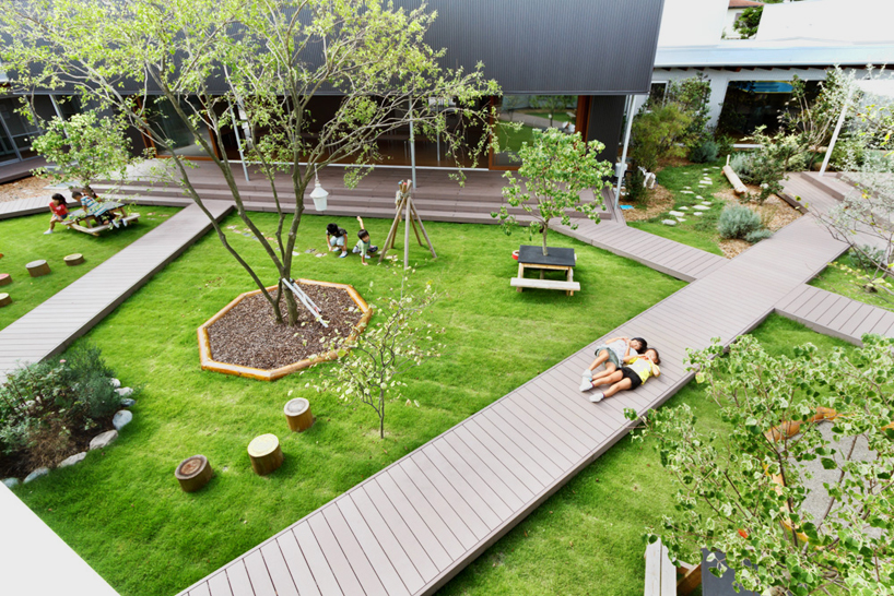 HIBINOSEKKEI + youji no shiro organize nursery around central courtyard