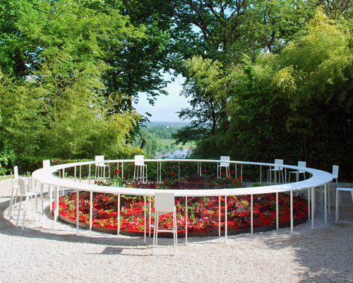 NAS architecture surrounds inaccessible garden of desire with circular table