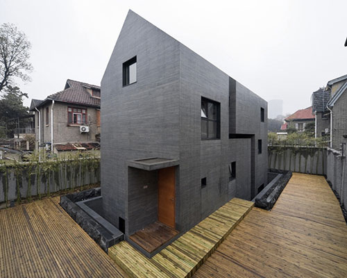 AZL architects carves a concrete block into the slit house 