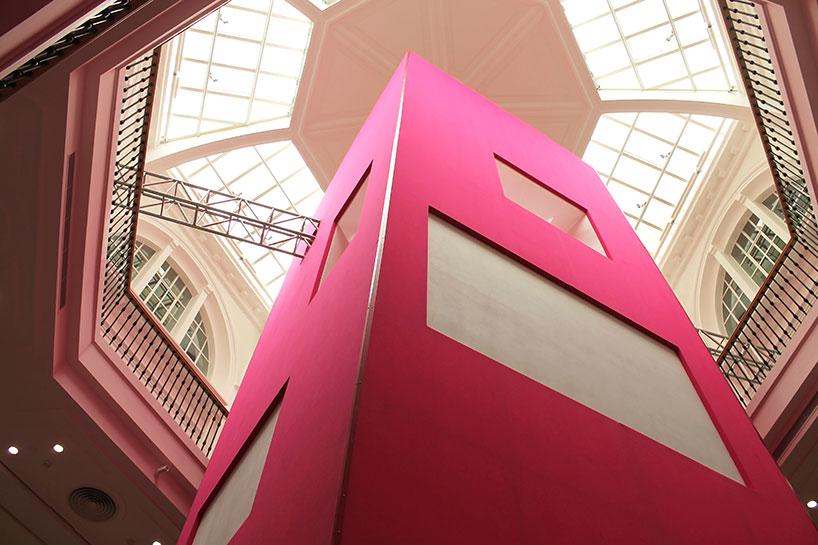 BaO architects traps pink fly tower within an octagonal void
