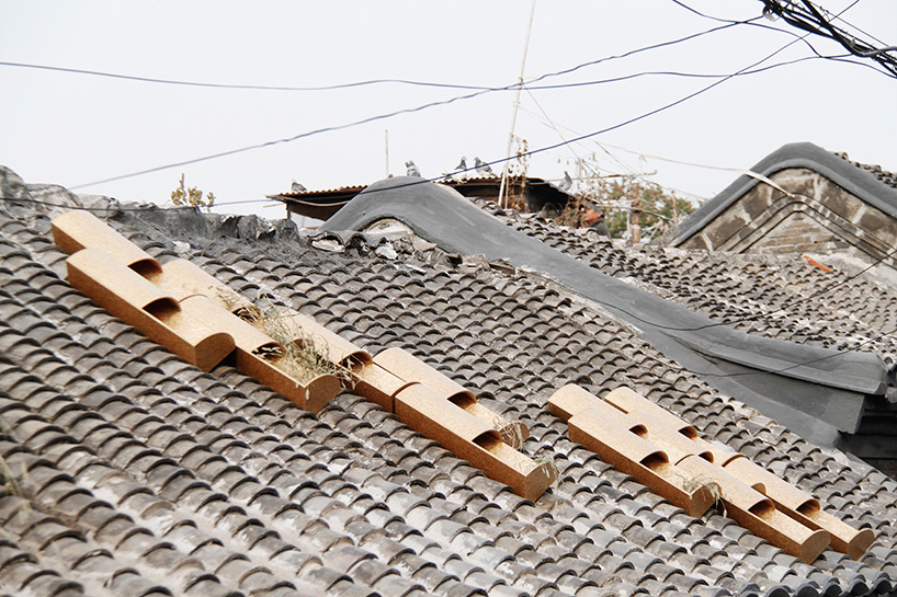 ODD nestles cat houses into grooves of hutong roofs in beijing