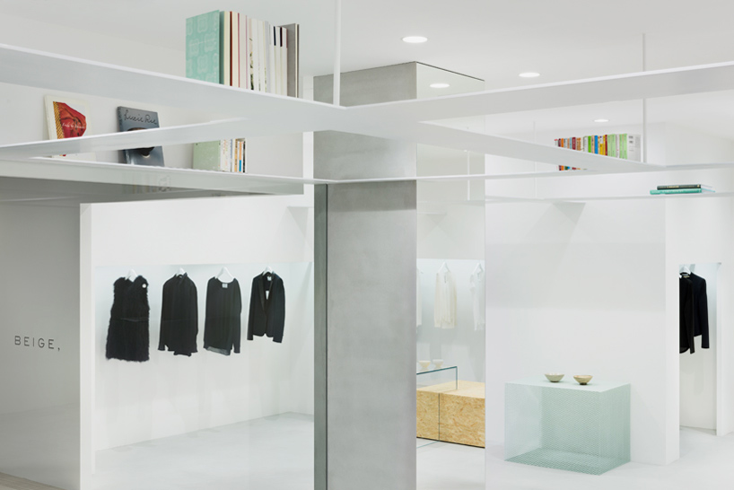 nendo suspends latticed bookshelves within concept store for beige