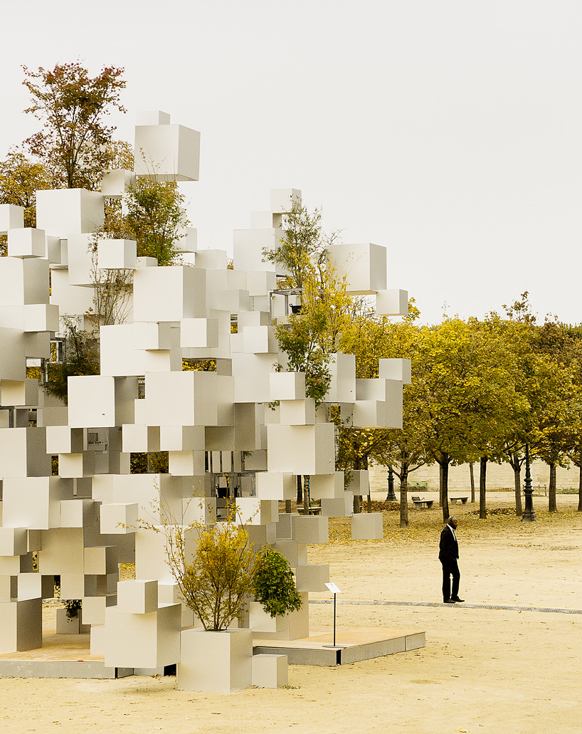 sou fujimoto adds greenery to layered cube installation in paris.