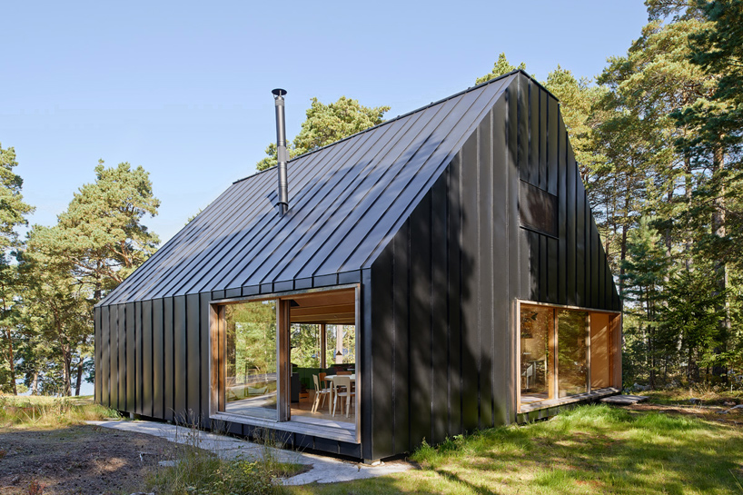 house husarö by tham & videgård forms a forest retreat