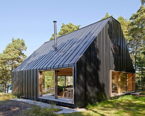 house husarö by tham & videgård forms a forest retreat