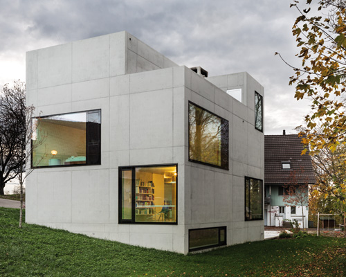 amrein herzig casts concrete house + studio in edlibach, switzerland