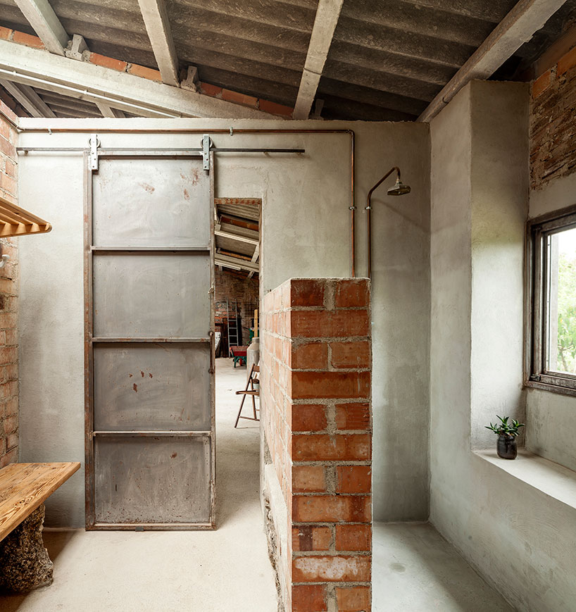 clara nubiola converts a deteriorating shed into the cube changing room