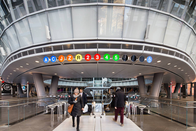 new york's fulton center transit hub topped with giant sky reflector-net