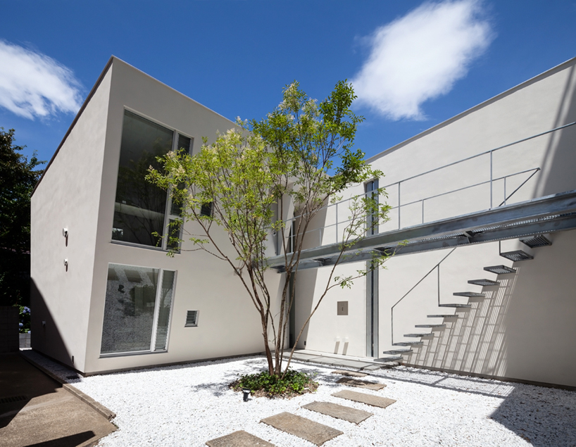 hiroshi shoji crafts a photographer's atelier in negishi, japan