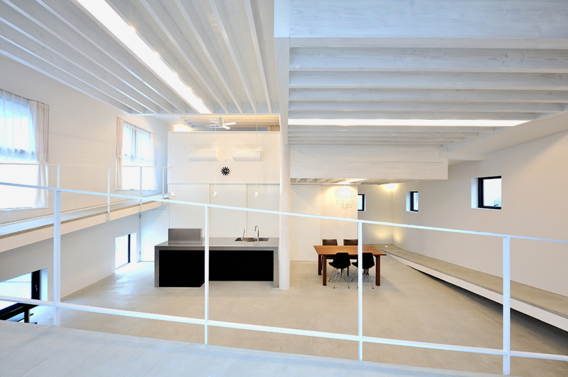 hisanori ban connects three storey house with gently ascending ramp