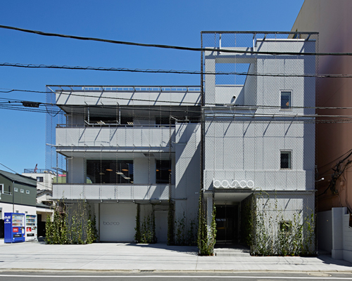 makoto yamaguchi design wraps former noodle factory with metal mesh