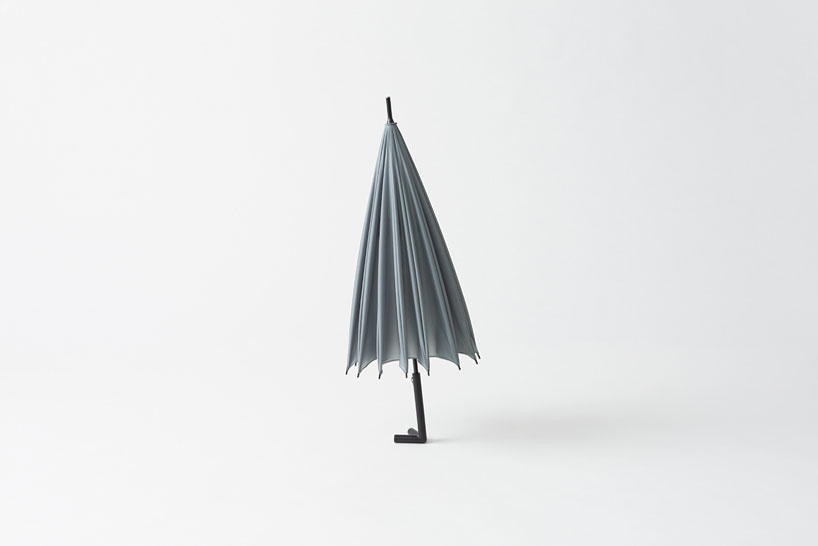 nendo-designed stay-brella for by | n stands + hangs on its own
