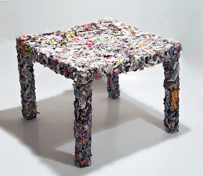 a table made from every single page of an IKEA catalogue