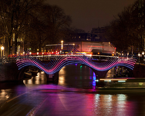 tjep. illuminates amsterdam's canals with undulating light bridge