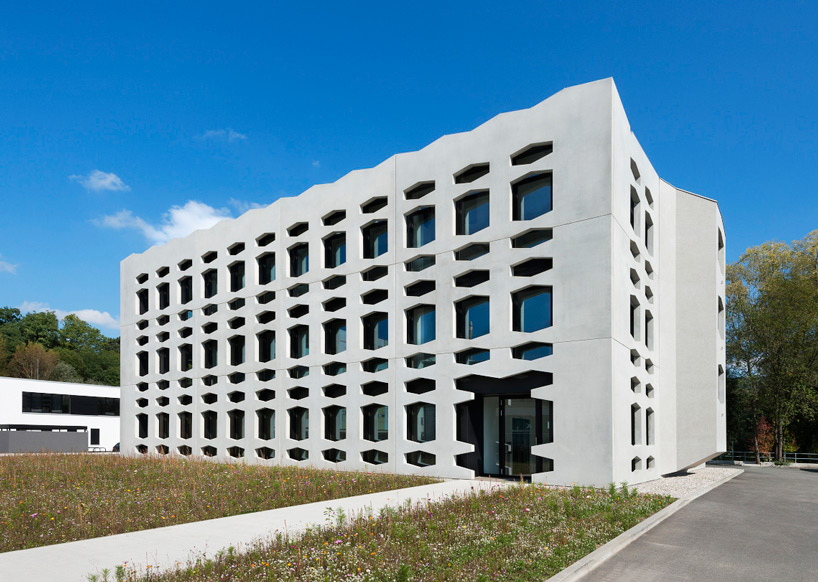 wurm+wurm covers neutrabuilding with perforated concrete shell