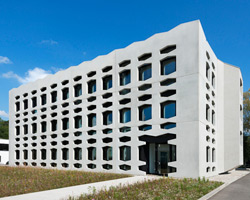 wurm+wurm covers neutrabuilding with perforated concrete shell
