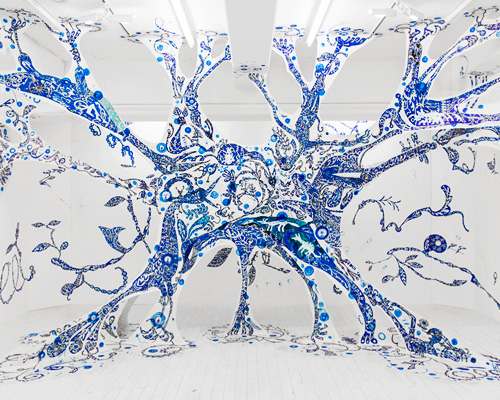yusuke asai stretches hand painted web within tokyo gallery