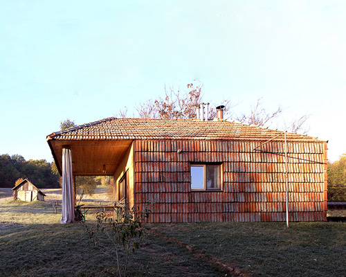zotov & co utilizes vernacular clay + wood construction for country house