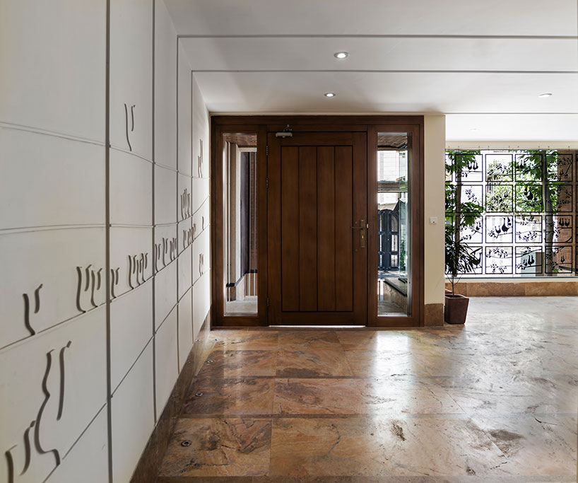 boozhgan architecture studio sculpts a dynamic brick facade for the haghighi house