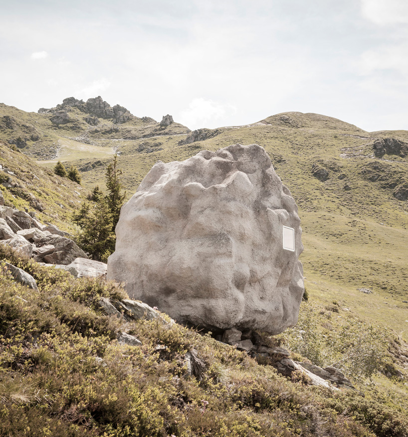 bureau A sites stone-shaped wooden cabin in the swiss alps