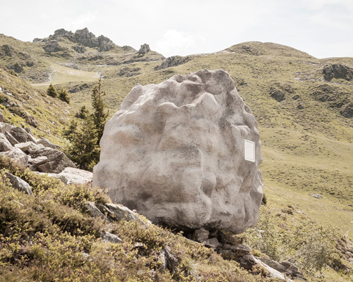 bureau A sites stone-shaped wooden cabin in the swiss alps