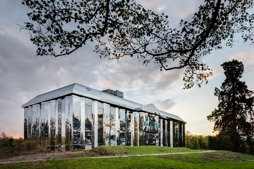 french country house re-clad with polished mirrored surfaces