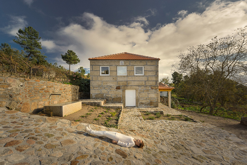 corpo atelier wood structure inside stone walls portugal designboom