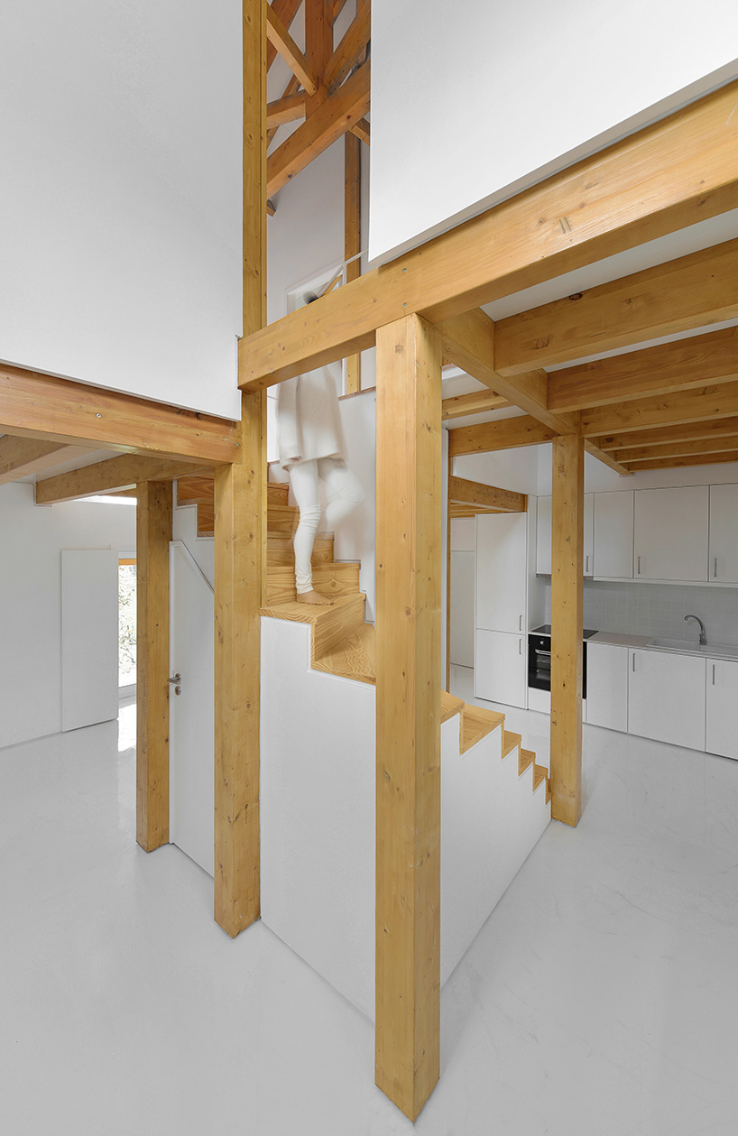 corpo atelier wood structure inside stone walls portugal designboom