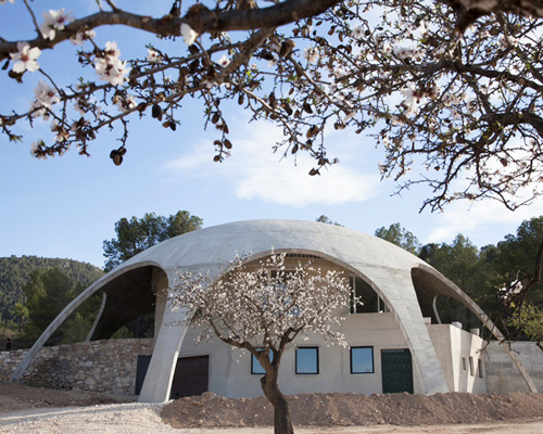 claudio hebberecht crafts artist's abode beneath concrete dome