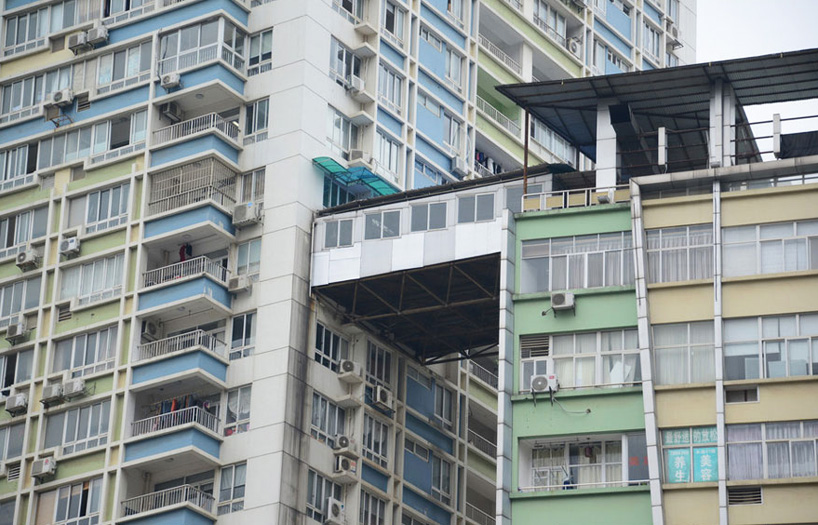 illegal corridor precariously bridges two highrise apartments in china