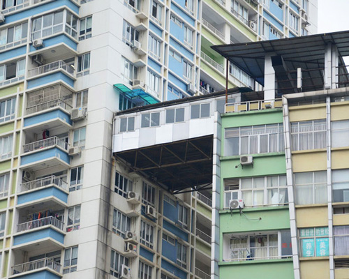 illegal corridor precariously bridges two highrise apartments in china