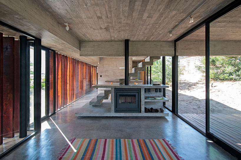 luciano kruk forms MR house of folded concrete and wooden louvers