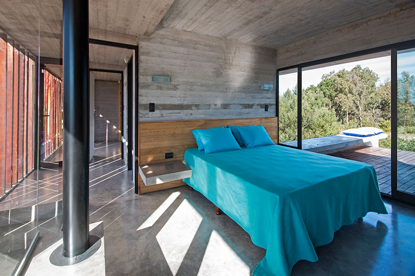 luciano kruk forms MR house of folded concrete and wooden louvers