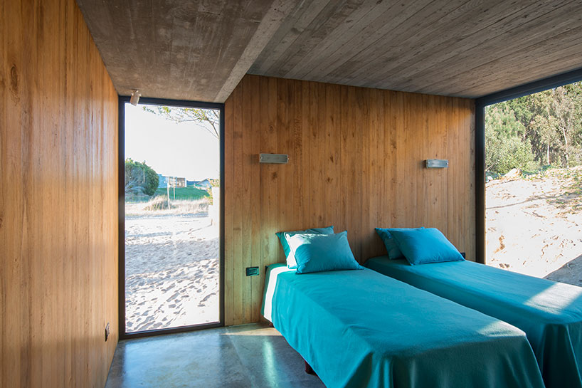 luciano kruk forms MR house of folded concrete and wooden louvers