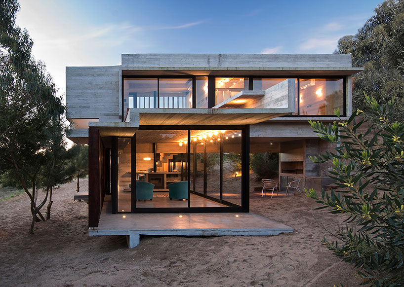 luciano kruk forms MR house of folded concrete and wooden louvers