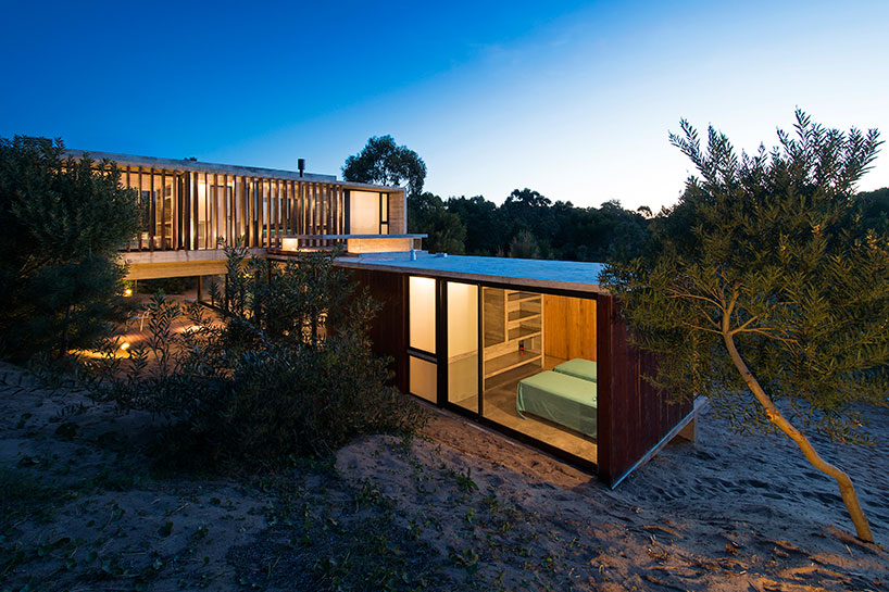 luciano kruk forms MR house of folded concrete and wooden louvers